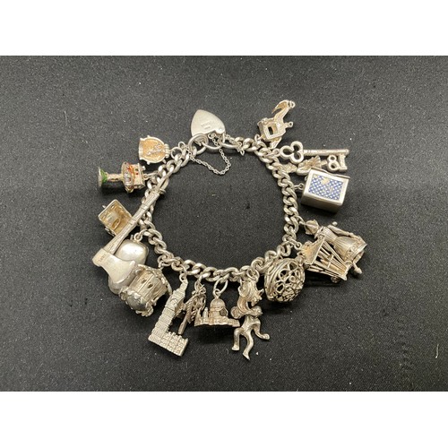 25 - SILVER CHARM BRACELET (TESTED) WITH 20 SILVER & WHITE METAL CHARMS W78.1G - LOCKET & CHAIN ENGLISH H... 