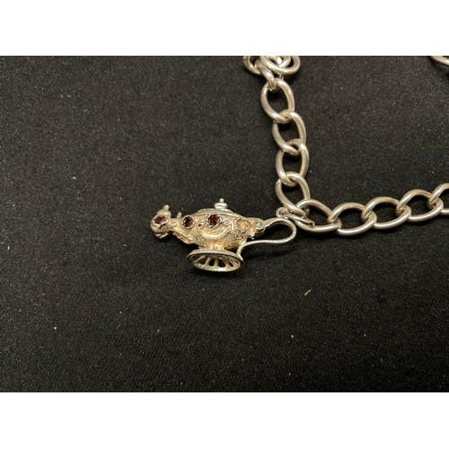 27 - 2 SILVER CHARM BRACELETS (TESTED) WITH A TOTAL OF 26 SILVER & WHITE METAL CHARMS - 2 ADDITIOINAL CHA... 