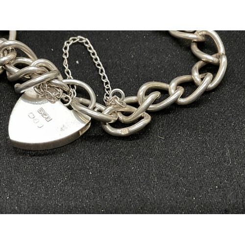 27 - 2 SILVER CHARM BRACELETS (TESTED) WITH A TOTAL OF 26 SILVER & WHITE METAL CHARMS - 2 ADDITIOINAL CHA... 