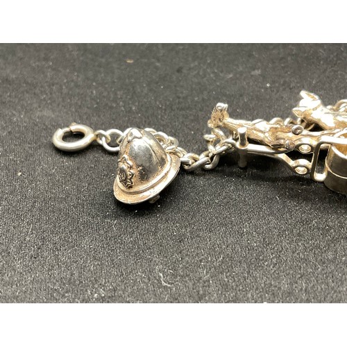 28 - 2 SILVER CHARM BRACELETS (TESTED) WITH A TOTAL OF 30 SILVER & WHITE METAL CHARMS TW104.2G
1 IS ENGLI... 