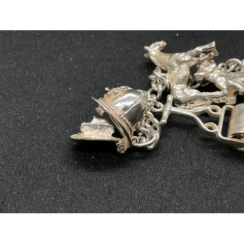 28 - 2 SILVER CHARM BRACELETS (TESTED) WITH A TOTAL OF 30 SILVER & WHITE METAL CHARMS TW104.2G
1 IS ENGLI... 