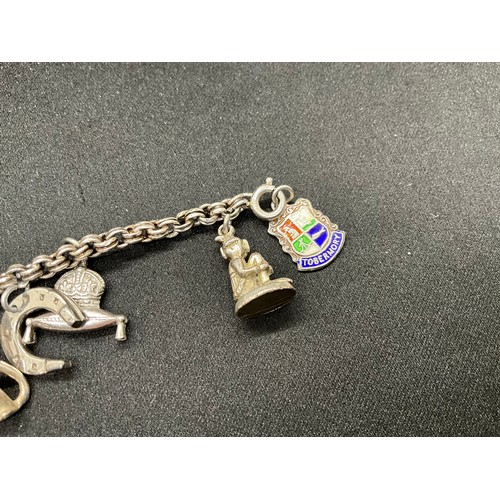 30 - 2 SILVER CHARM BRACELETS (TESTED) WITH A TOTAL OF 33 SILVER & WHITE METAL CHARMS - 1 ADDITIONAL CHAR... 