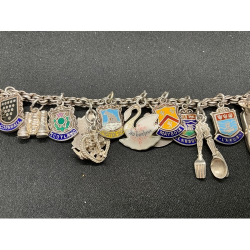 30 - 2 SILVER CHARM BRACELETS (TESTED) WITH A TOTAL OF 33 SILVER & WHITE METAL CHARMS - 1 ADDITIONAL CHAR... 