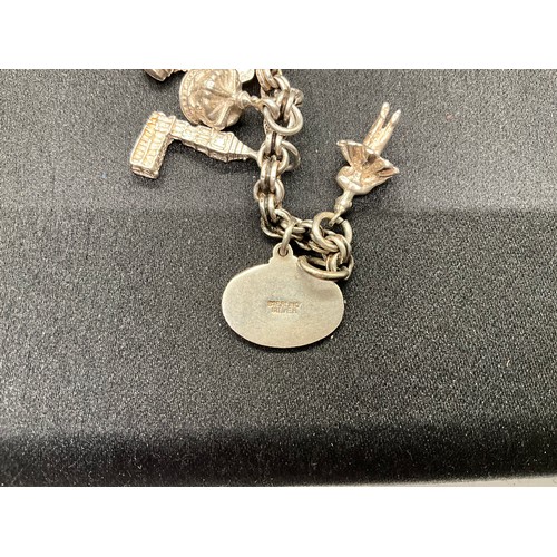 30 - 2 SILVER CHARM BRACELETS (TESTED) WITH A TOTAL OF 33 SILVER & WHITE METAL CHARMS - 1 ADDITIONAL CHAR... 