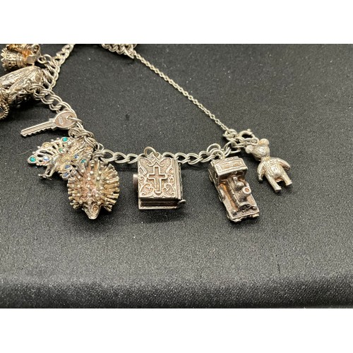 30 - 2 SILVER CHARM BRACELETS (TESTED) WITH A TOTAL OF 33 SILVER & WHITE METAL CHARMS - 1 ADDITIONAL CHAR... 