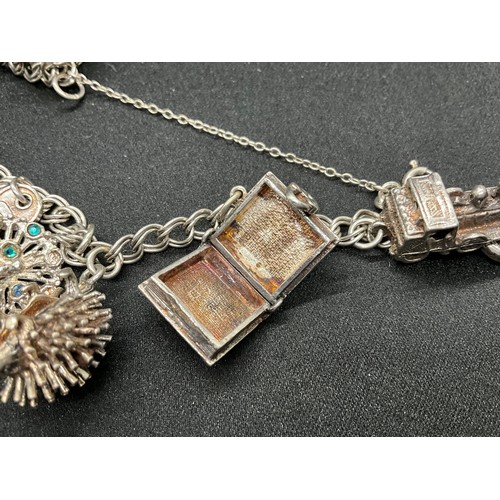 30 - 2 SILVER CHARM BRACELETS (TESTED) WITH A TOTAL OF 33 SILVER & WHITE METAL CHARMS - 1 ADDITIONAL CHAR... 