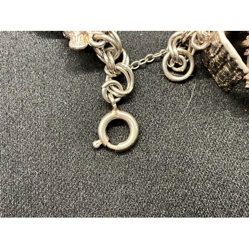 30 - 2 SILVER CHARM BRACELETS (TESTED) WITH A TOTAL OF 33 SILVER & WHITE METAL CHARMS - 1 ADDITIONAL CHAR... 