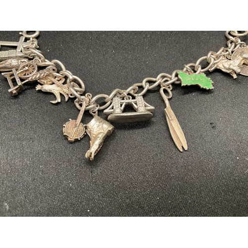 32 - 2 SILVER CHARM BRACELETS (TESTED) WITH A TOTAL OF 23 SILVER & WHITE METAL CHARMS TW71.3G
CLASP ON ON... 