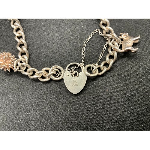 32 - 2 SILVER CHARM BRACELETS (TESTED) WITH A TOTAL OF 23 SILVER & WHITE METAL CHARMS TW71.3G
CLASP ON ON... 