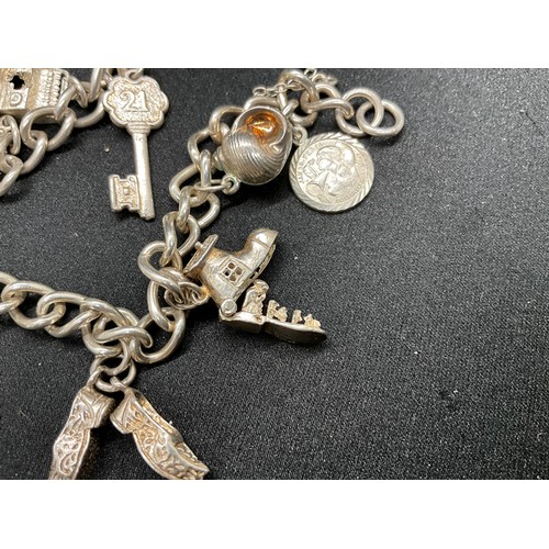 35 - 1 SILVER CHARM BRACELET (TESTED)  AND 1 BRACELET PLATED - WITH A TOTAL OF 19 SILVER CHARMS  WITH 1 A... 