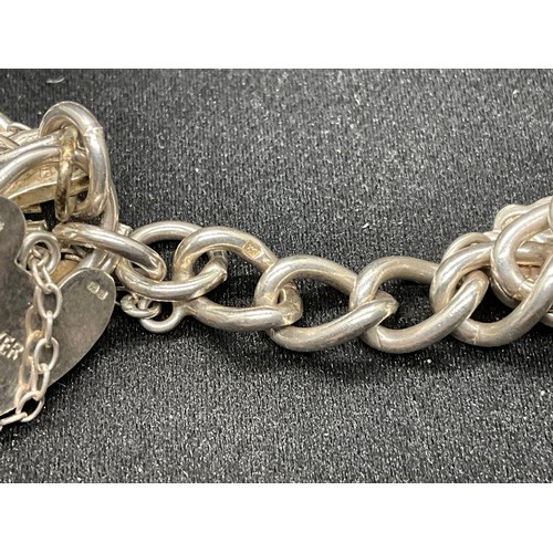 35 - 1 SILVER CHARM BRACELET (TESTED)  AND 1 BRACELET PLATED - WITH A TOTAL OF 19 SILVER CHARMS  WITH 1 A... 