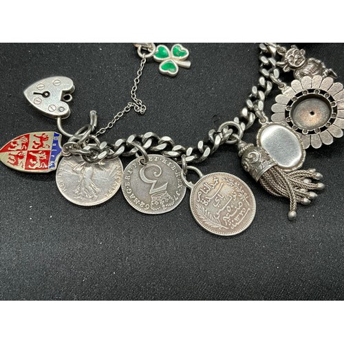 36 - 2 SILVER CHARM BRACELETS (TESTED) WITH A TOTAL OF 26 SILVER & WHITE METAL CHARMS W91.6G
1 BRACELET H... 