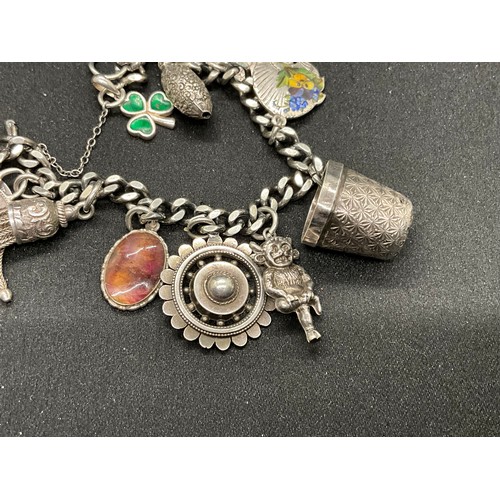 36 - 2 SILVER CHARM BRACELETS (TESTED) WITH A TOTAL OF 26 SILVER & WHITE METAL CHARMS W91.6G
1 BRACELET H... 