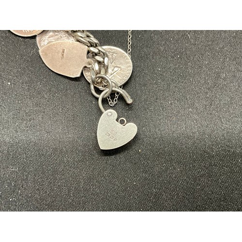 36 - 2 SILVER CHARM BRACELETS (TESTED) WITH A TOTAL OF 26 SILVER & WHITE METAL CHARMS W91.6G
1 BRACELET H... 