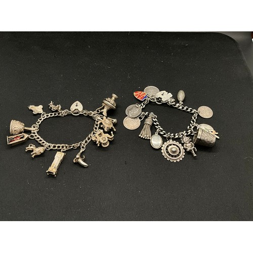 36 - 2 SILVER CHARM BRACELETS (TESTED) WITH A TOTAL OF 26 SILVER & WHITE METAL CHARMS W91.6G
1 BRACELET H... 