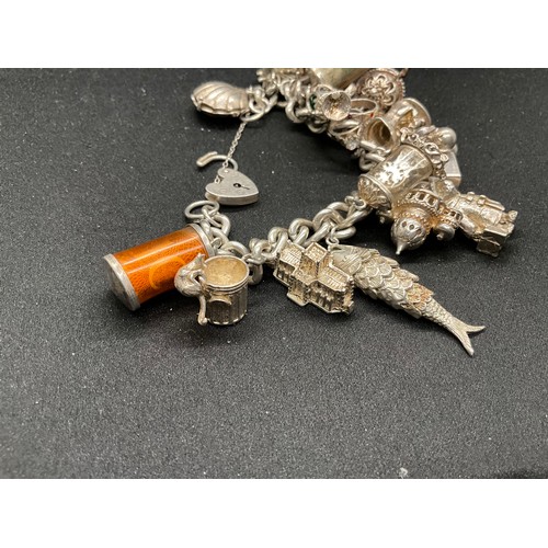 39 - HALLMARKED SILVER CHARM BRACELET WITH 19 SILVER & WHITE METAL CHARMS TW123.2G - ENGLISH HALLMARK SIL... 