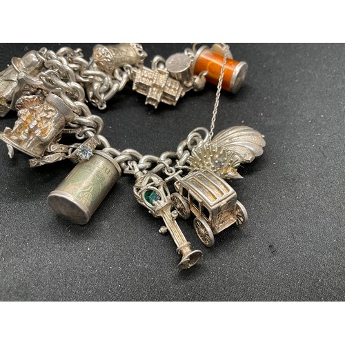 39 - HALLMARKED SILVER CHARM BRACELET WITH 19 SILVER & WHITE METAL CHARMS TW123.2G - ENGLISH HALLMARK SIL... 