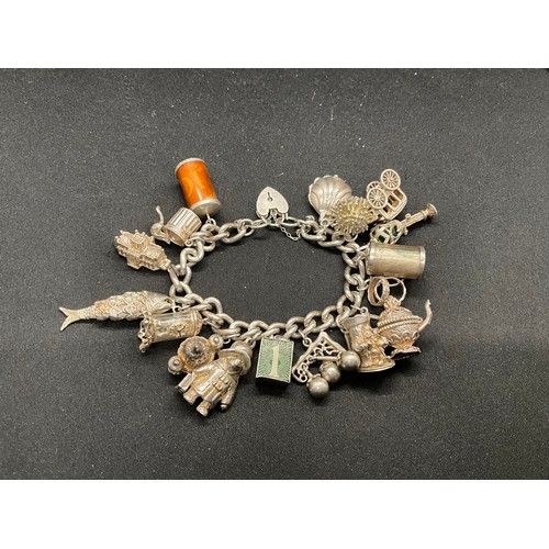 39 - HALLMARKED SILVER CHARM BRACELET WITH 19 SILVER & WHITE METAL CHARMS TW123.2G - ENGLISH HALLMARK SIL... 