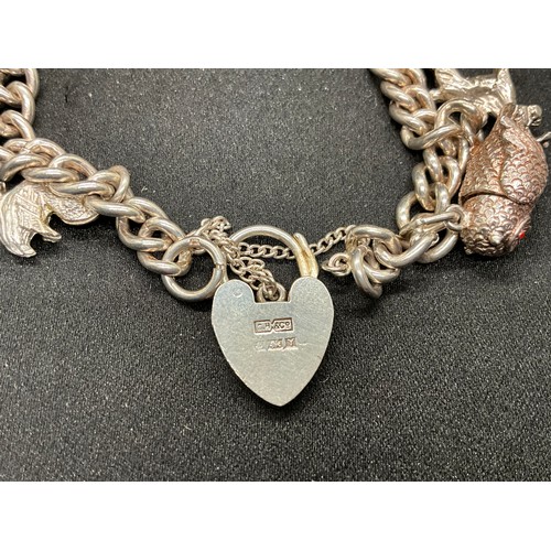 40 - 2 SILVER CHARM BRACELETS (TESTED)WITH A TOTAL OF 26 SILVER & WHITE METAL CHARMS W67.7G
BOTH LOCKETS ... 