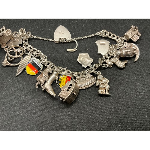 40 - 2 SILVER CHARM BRACELETS (TESTED)WITH A TOTAL OF 26 SILVER & WHITE METAL CHARMS W67.7G
BOTH LOCKETS ... 