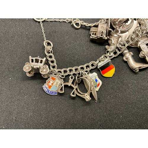 40 - 2 SILVER CHARM BRACELETS (TESTED)WITH A TOTAL OF 26 SILVER & WHITE METAL CHARMS W67.7G
BOTH LOCKETS ... 
