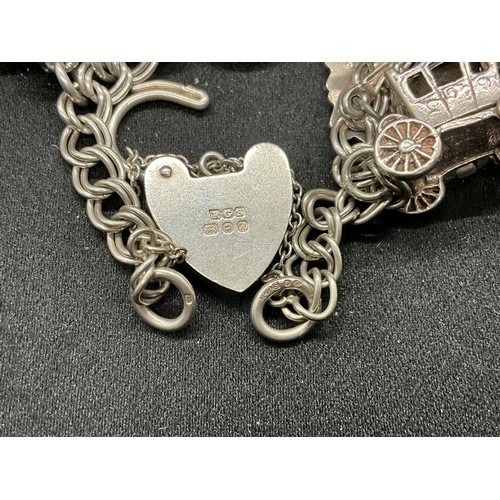 40 - 2 SILVER CHARM BRACELETS (TESTED)WITH A TOTAL OF 26 SILVER & WHITE METAL CHARMS W67.7G
BOTH LOCKETS ... 