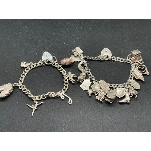 40 - 2 SILVER CHARM BRACELETS (TESTED)WITH A TOTAL OF 26 SILVER & WHITE METAL CHARMS W67.7G
BOTH LOCKETS ... 