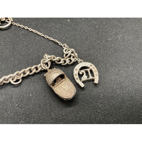 41 - 2 SILVER CHARM BRACELETS (TESTED) WITH TOTAL OF 32 SILVER & WHITE METAL CHARMS  TW94.1G
1 LOCKET IS ... 
