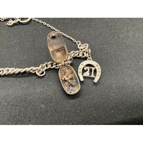 41 - 2 SILVER CHARM BRACELETS (TESTED) WITH TOTAL OF 32 SILVER & WHITE METAL CHARMS  TW94.1G
1 LOCKET IS ... 