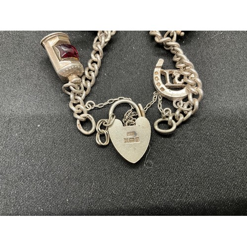 41 - 2 SILVER CHARM BRACELETS (TESTED) WITH TOTAL OF 32 SILVER & WHITE METAL CHARMS  TW94.1G
1 LOCKET IS ... 