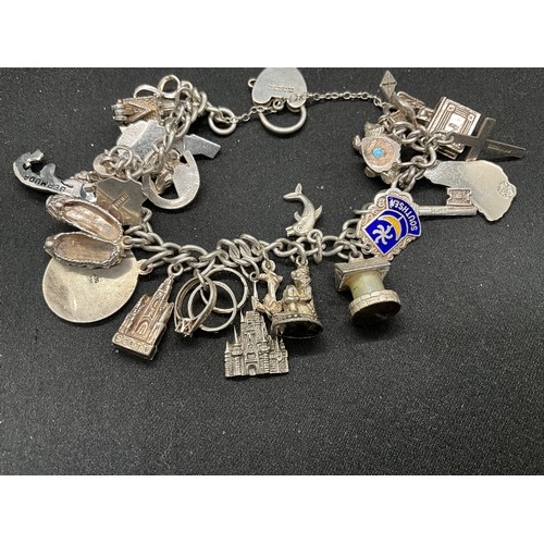 41 - 2 SILVER CHARM BRACELETS (TESTED) WITH TOTAL OF 32 SILVER & WHITE METAL CHARMS  TW94.1G
1 LOCKET IS ... 