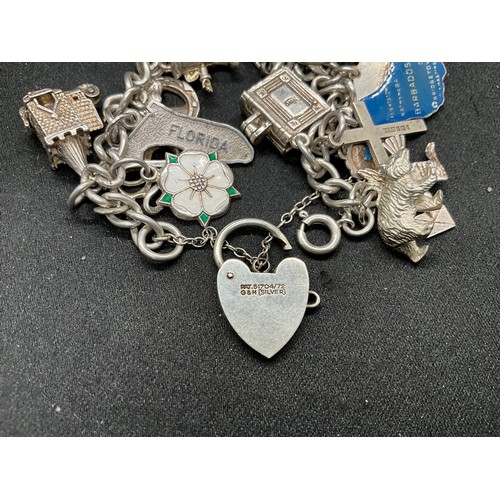 41 - 2 SILVER CHARM BRACELETS (TESTED) WITH TOTAL OF 32 SILVER & WHITE METAL CHARMS  TW94.1G
1 LOCKET IS ... 