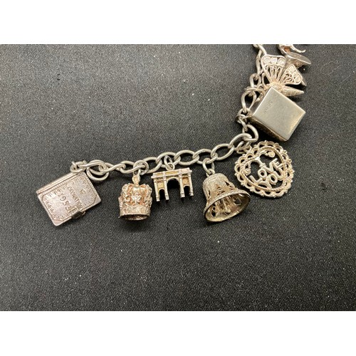 42 - 2 SILVER CHARM BRACELETS (TESTED)WITH A TOTAL OF 24 SILVER & WHITE METAL CHARMS TW78.8G
1 BRACELET H... 