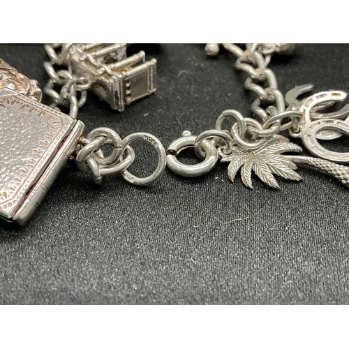 42 - 2 SILVER CHARM BRACELETS (TESTED)WITH A TOTAL OF 24 SILVER & WHITE METAL CHARMS TW78.8G
1 BRACELET H... 