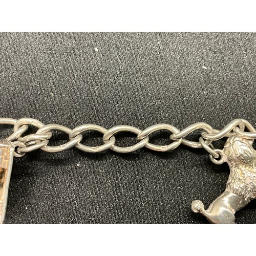 42 - 2 SILVER CHARM BRACELETS (TESTED)WITH A TOTAL OF 24 SILVER & WHITE METAL CHARMS TW78.8G
1 BRACELET H... 