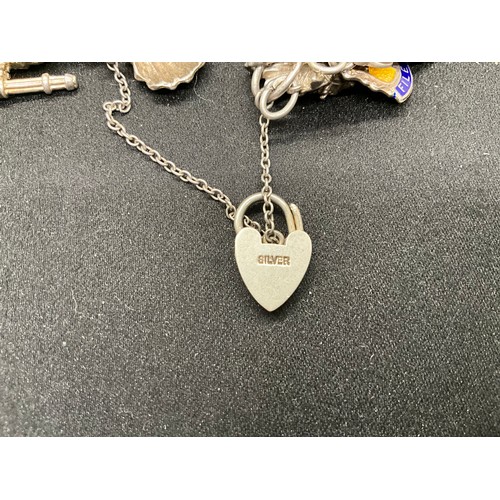 44 - SILVER CHARM BRACELET (TESTED) WITH 39 SILVER & WHITE METAL CHARMS 1 ADDITIONAL CHARM IS BRACELET W1... 