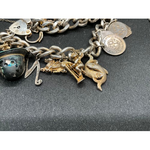 45 - 2 SILVER CHARM BRACLETS (TESTED) WITH A TOTAL OF 24 SILVER CHARMS TW83.7G
1 BRACELET HAS ENGLISH HAL... 