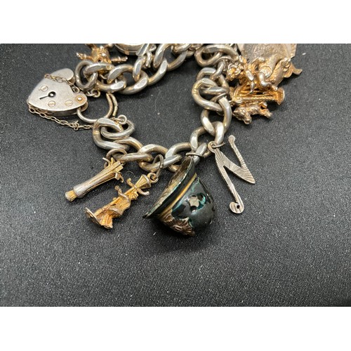 45 - 2 SILVER CHARM BRACLETS (TESTED) WITH A TOTAL OF 24 SILVER CHARMS TW83.7G
1 BRACELET HAS ENGLISH HAL... 