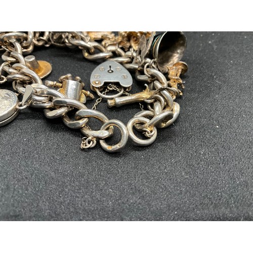 45 - 2 SILVER CHARM BRACLETS (TESTED) WITH A TOTAL OF 24 SILVER CHARMS TW83.7G
1 BRACELET HAS ENGLISH HAL... 