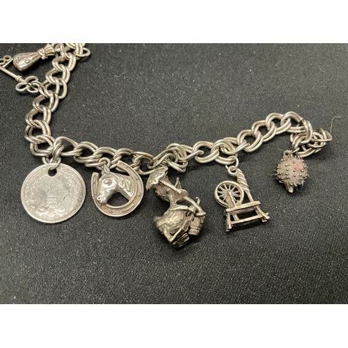 45 - 2 SILVER CHARM BRACLETS (TESTED) WITH A TOTAL OF 24 SILVER CHARMS TW83.7G
1 BRACELET HAS ENGLISH HAL... 