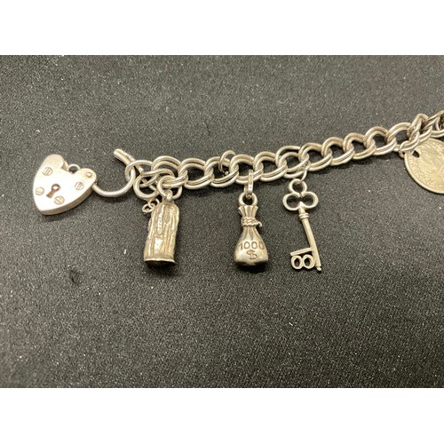 45 - 2 SILVER CHARM BRACLETS (TESTED) WITH A TOTAL OF 24 SILVER CHARMS TW83.7G
1 BRACELET HAS ENGLISH HAL... 