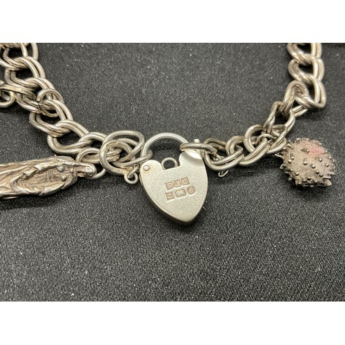 45 - 2 SILVER CHARM BRACLETS (TESTED) WITH A TOTAL OF 24 SILVER CHARMS TW83.7G
1 BRACELET HAS ENGLISH HAL... 