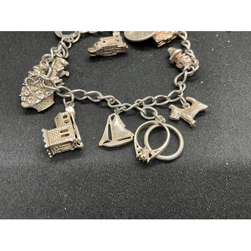 46 - 2 SILVER CHARM BRACELETS (TESTED) WITH A TOTAL OF 20 SILVER CHARMS TW49.1G
1 LOBSTER CLASP ON ONE BR... 