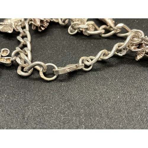 46 - 2 SILVER CHARM BRACELETS (TESTED) WITH A TOTAL OF 20 SILVER CHARMS TW49.1G
1 LOBSTER CLASP ON ONE BR... 
