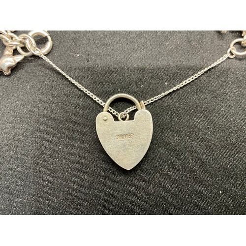 47 - 2 STERLING SILVER CHARM BRACELETS WITH 17 SILVER CHARMS W36.1G
CLASP ON ONE BRACELET IS PLATED, LOCK... 