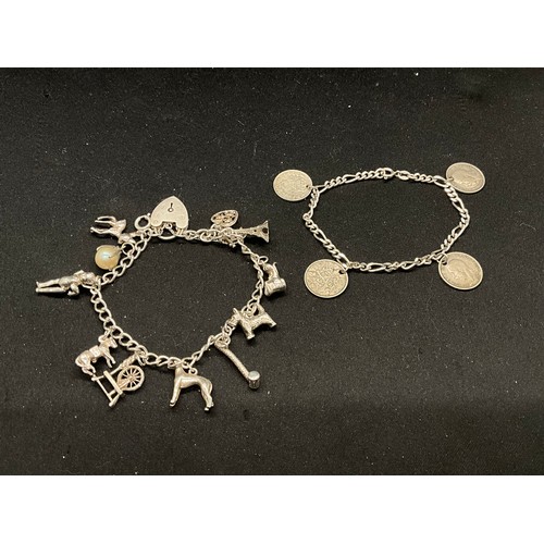47 - 2 STERLING SILVER CHARM BRACELETS WITH 17 SILVER CHARMS W36.1G
CLASP ON ONE BRACELET IS PLATED, LOCK... 