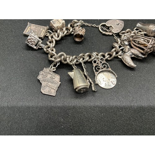 48 - 2 SILVER CHARM BRACELETS (TESTED) WITH A TOTAL OF 22 SILVER & WHITE METAL CHARMS TW106.2G - 1 LOCKET... 