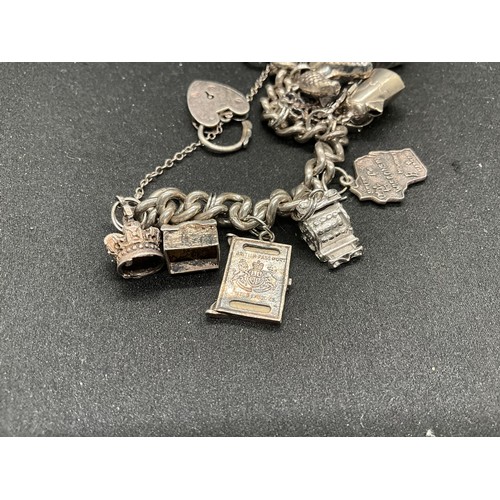 48 - 2 SILVER CHARM BRACELETS (TESTED) WITH A TOTAL OF 22 SILVER & WHITE METAL CHARMS TW106.2G - 1 LOCKET... 