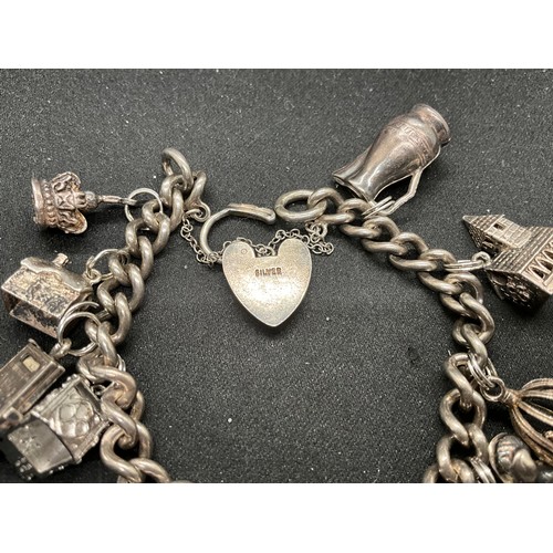 48 - 2 SILVER CHARM BRACELETS (TESTED) WITH A TOTAL OF 22 SILVER & WHITE METAL CHARMS TW106.2G - 1 LOCKET... 