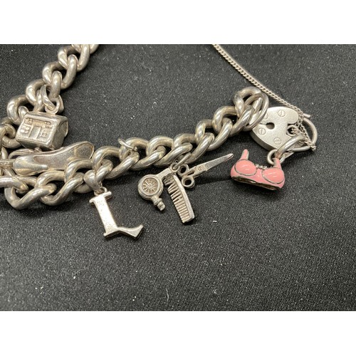 48 - 2 SILVER CHARM BRACELETS (TESTED) WITH A TOTAL OF 22 SILVER & WHITE METAL CHARMS TW106.2G - 1 LOCKET... 